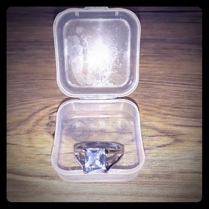 Square cut white sapphire ring.